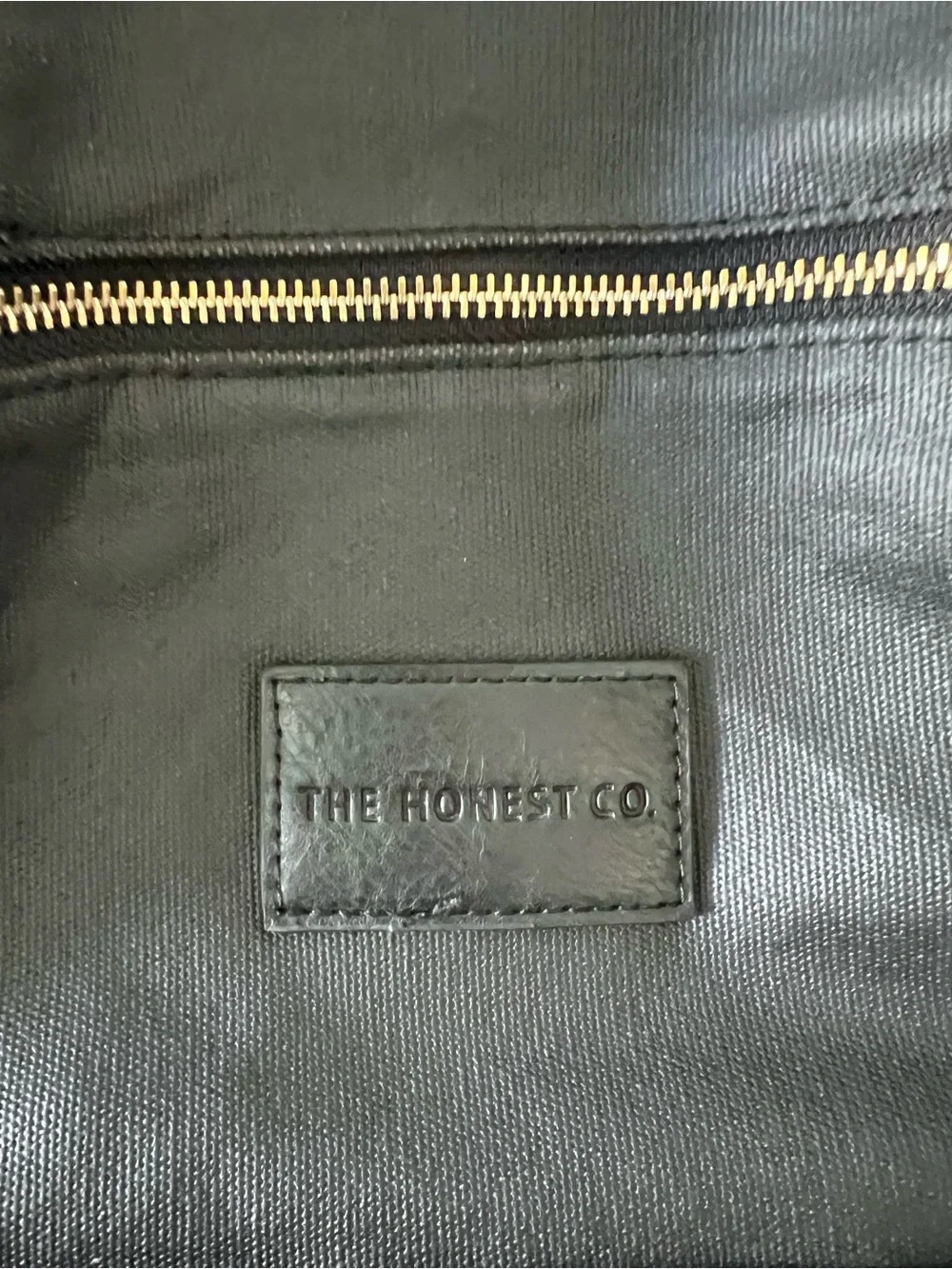 Black diaper backpack by The Honest Company